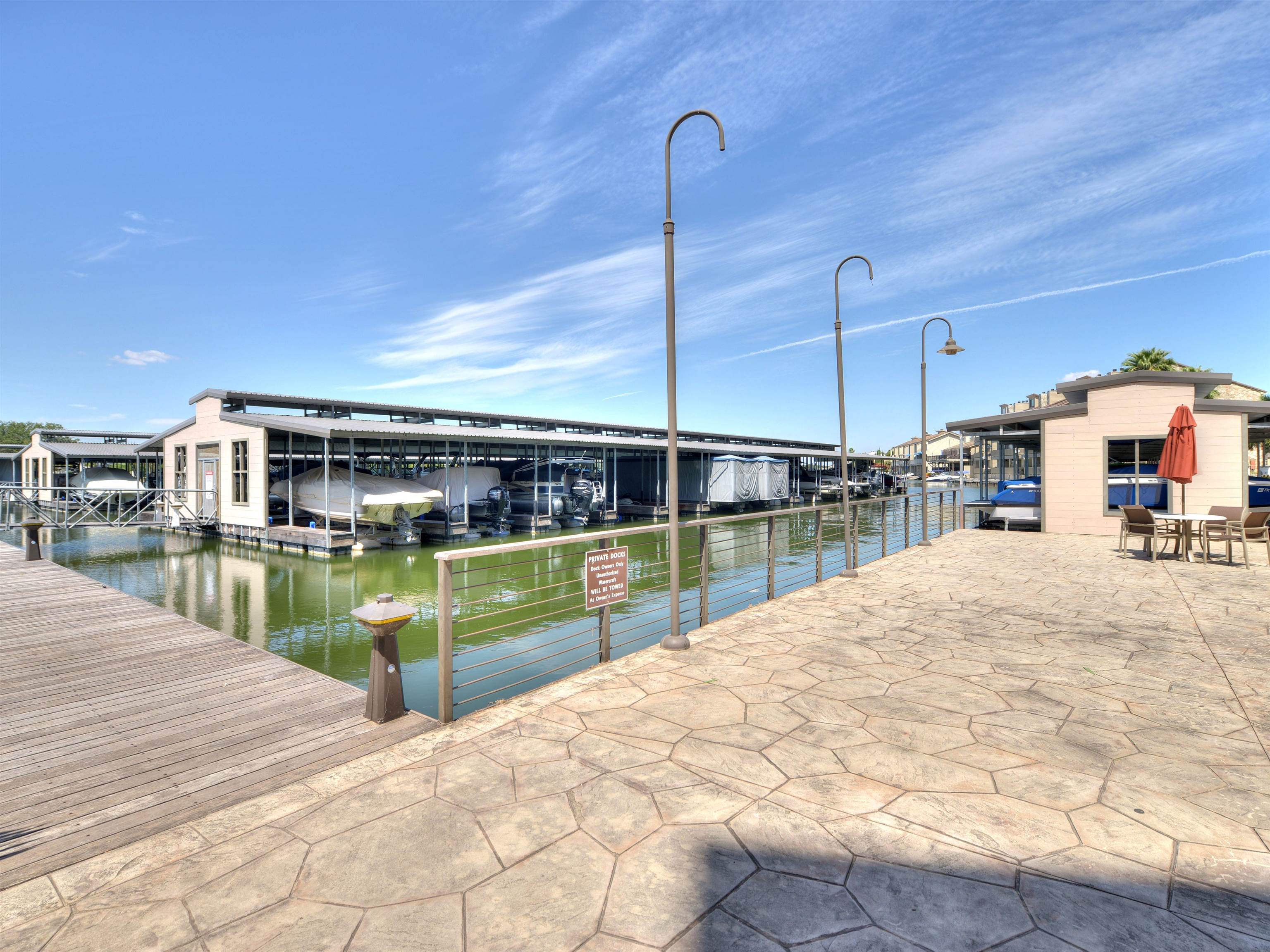 101 West Bank, Unit 52 Horseshoe Bay, TX 78657 - Photo 26 of 30 a swimming pool with a yard