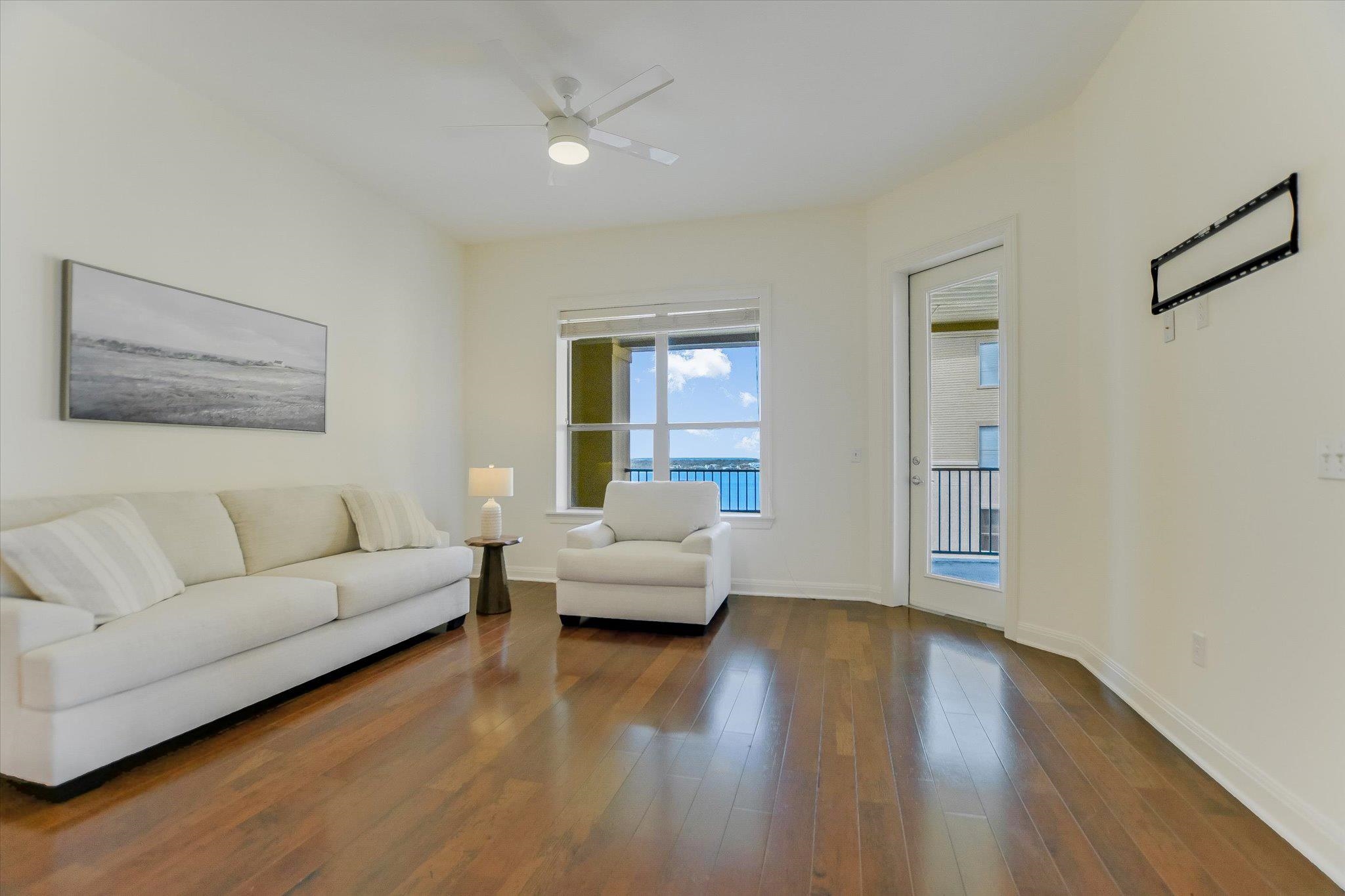 101 West Bank, Unit 52 Horseshoe Bay, TX 78657 - Photo 9 of 30 a living room with furniture and a large window