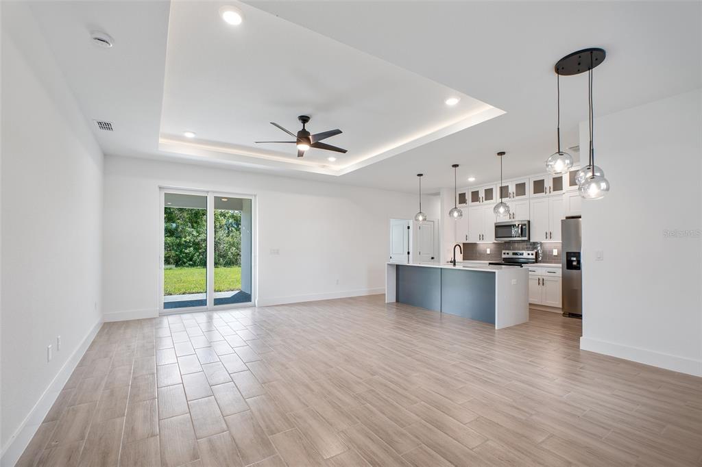 24419 Southwest Kingsway Circle Punta Gorda, FL 33983 - Photo 11 of 51 a view of kitchen with stainless steel appliances granite countertop a sink and a refrigerator