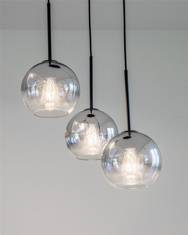 24419 Southwest Kingsway Circle Punta Gorda, FL 33983 - Photo 19 of 51 a close view of dining table in wooden floor