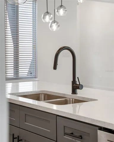 a kitchen with a sink and a window
