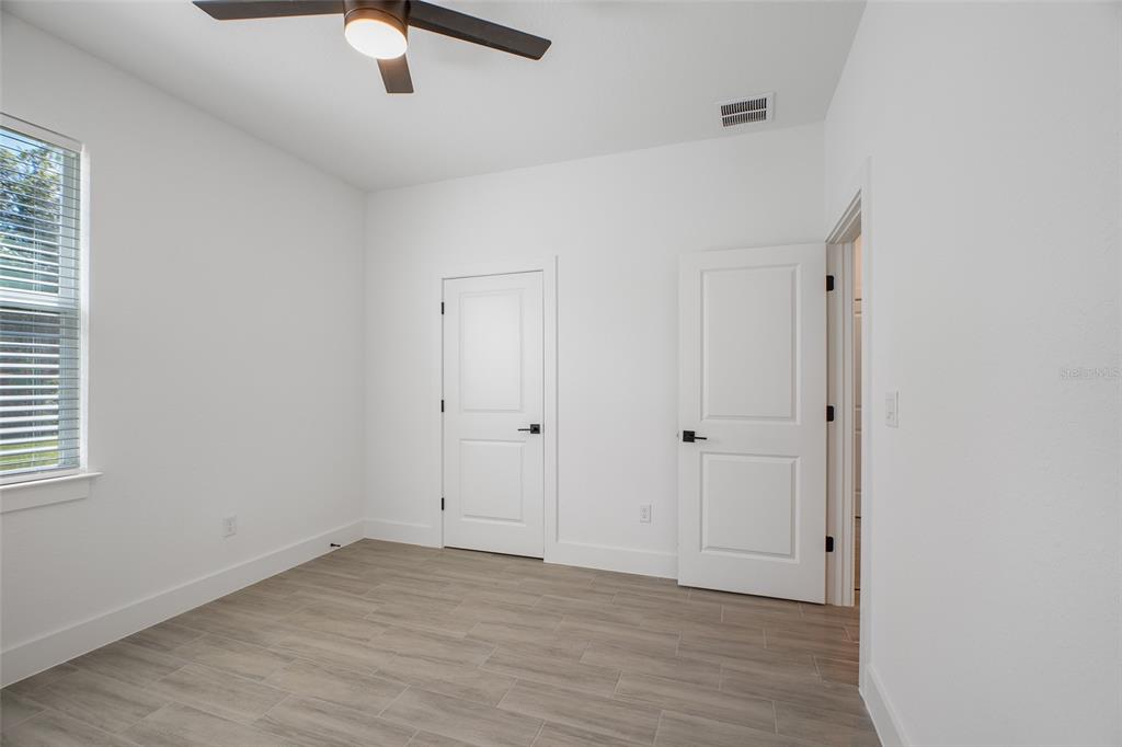 24419 Southwest Kingsway Circle Punta Gorda, FL 33983 - Photo 23 of 51 wooden floor in an empty room