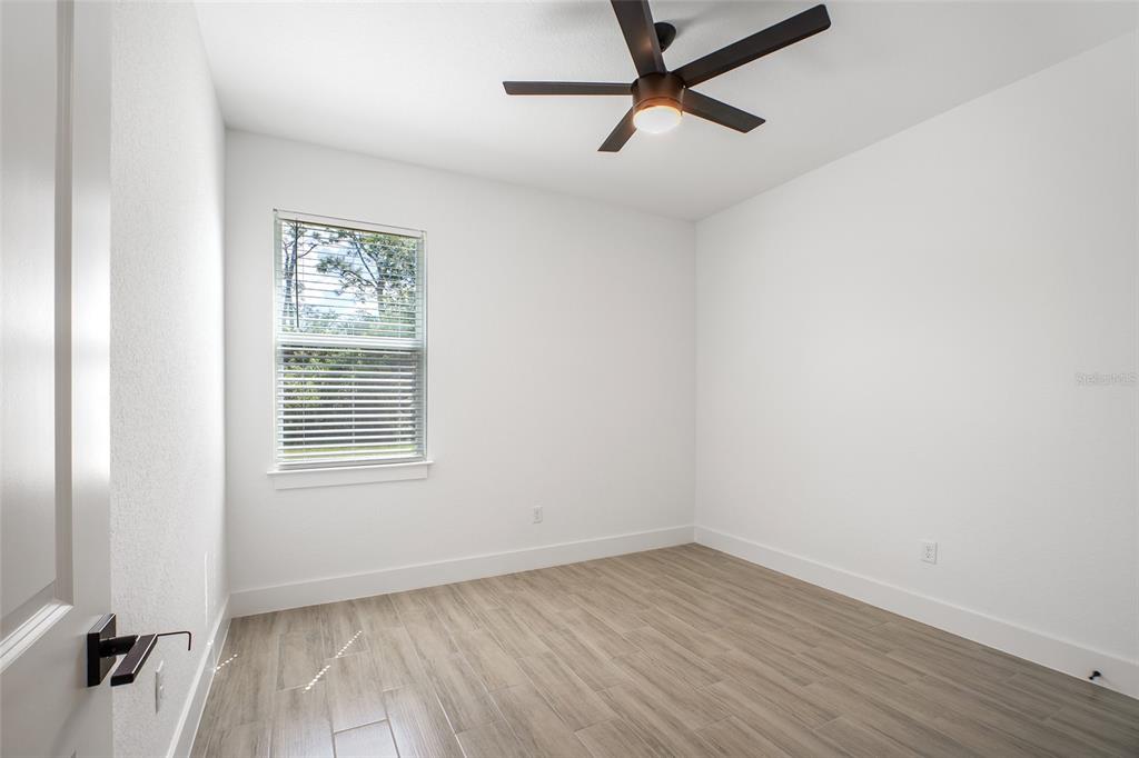 24419 Southwest Kingsway Circle Punta Gorda, FL 33983 - Photo 30 of 51 an empty room with a window