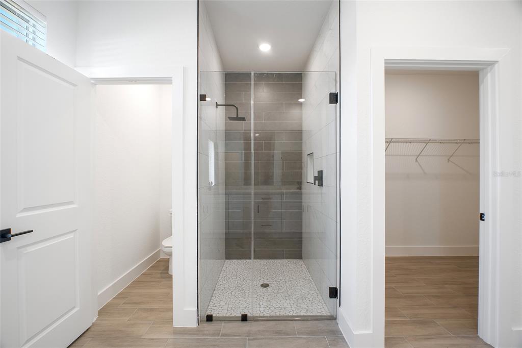 24419 Southwest Kingsway Circle Punta Gorda, FL 33983 - Photo 43 of 51 a bathroom with a glass shower door