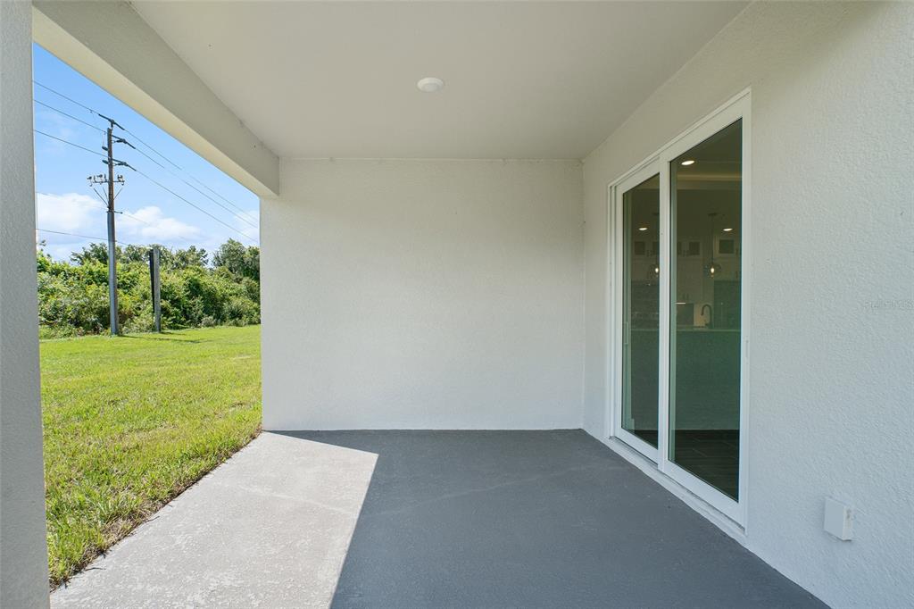 24419 Southwest Kingsway Circle Punta Gorda, FL 33983 - Photo 47 of 51 a view of a back yard from a window