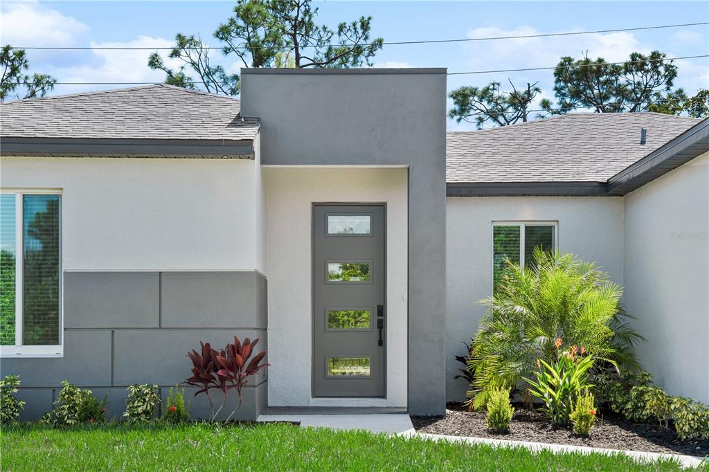 24419 Southwest Kingsway Circle Punta Gorda, FL 33983 - Photo 8 of 51 a view of a house with potted plants