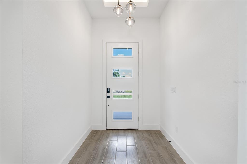 24419 Southwest Kingsway Circle Punta Gorda, FL 33983 - Photo 10 of 51 a view of an empty room with a window