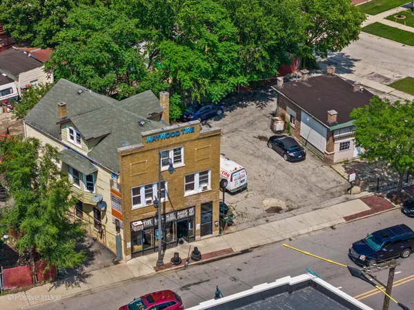 an aerial view of multiple houses with yard