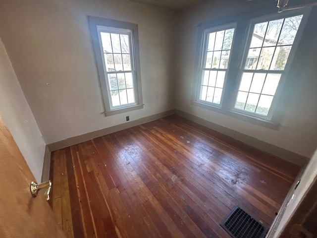 529 North 2nd Street Watseka, IL 60970 - Photo 4 of 11 a view of an empty room with wooden floor and a window