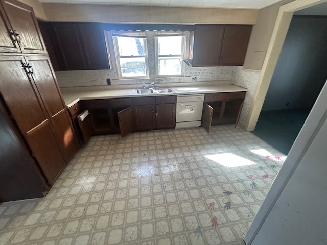 529 North 2nd Street Watseka, IL 60970 - Photo 6 of 11 a kitchen with stainless steel appliances granite countertop a sink stove and cabinets