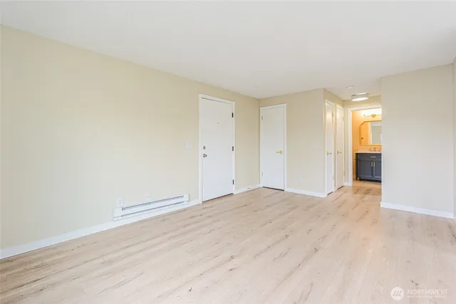 a view of a kitchen with wooden floor