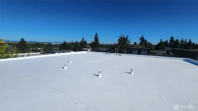 a balcony with wooden floor and fence