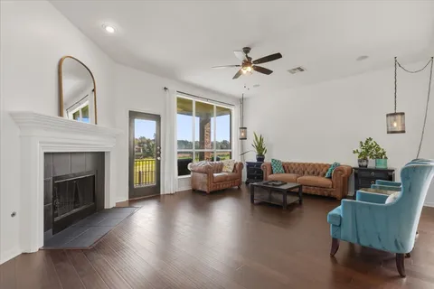 a living room with furniture and a fireplace