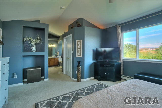 1598 P Road Loma, CO 81524 - Photo 11 of 25 a bedroom with a bed and a dresser in it