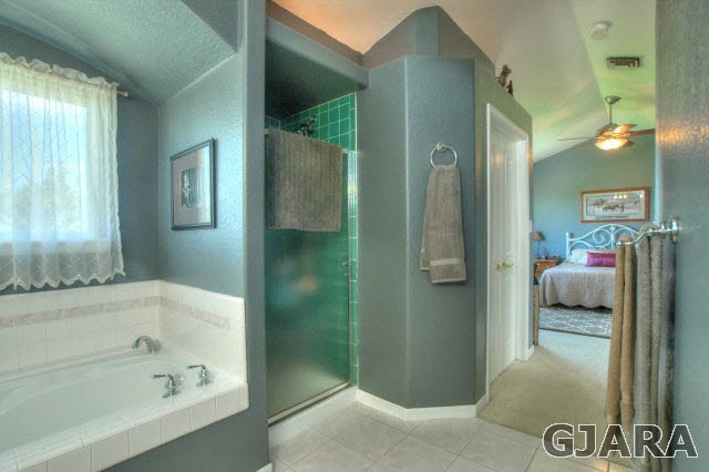 1598 P Road Loma, CO 81524 - Photo 13 of 25 a bathroom with a bathtub and a shower