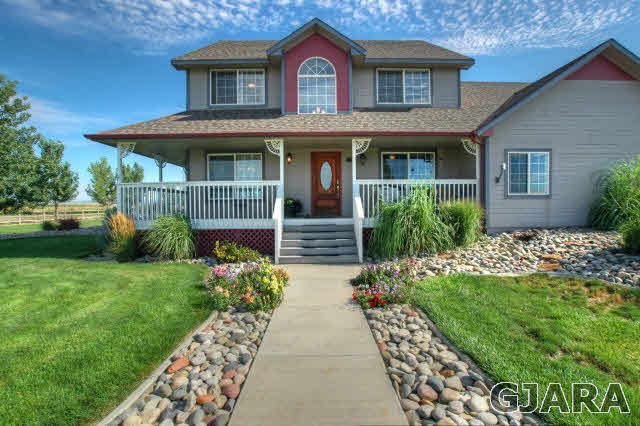 1598 P Road Loma, CO 81524 - Photo 2 of 25 a front view of a house with garden