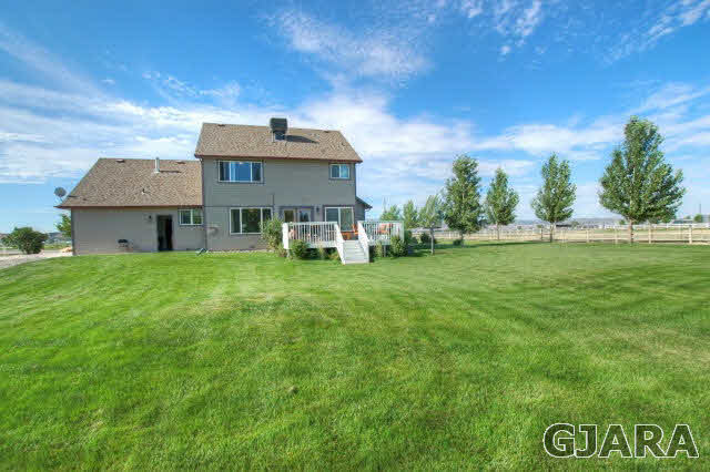 1598 P Road Loma, CO 81524 - Photo 22 of 25 a front view of a house with garden