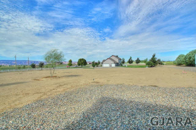 1598 P Road Loma, CO 81524 - Photo 23 of 25 a view of a lake with houses in back