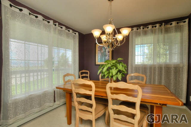 1598 P Road Loma, CO 81524 - Photo 6 of 25 a view of a dining room with furniture and a chandelier