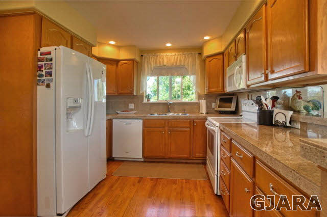 1598 P Road Loma, CO 81524 - Photo 7 of 25 a kitchen with stainless steel appliances granite countertop a refrigerator a sink and a stove