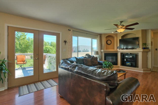 1598 P Road Loma, CO 81524 - Photo 9 of 25 a living room with furniture a large window and a fireplace