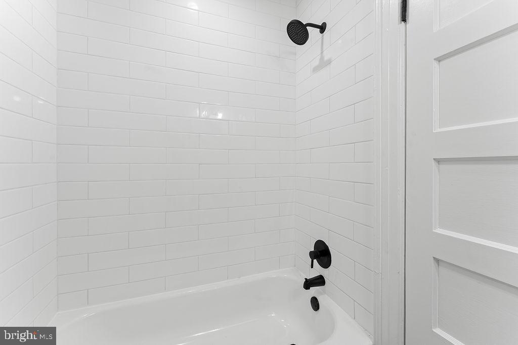 10221 Dahlgren Road King George, VA 22485 - Photo 13 of 31 a bathroom with a bathtub