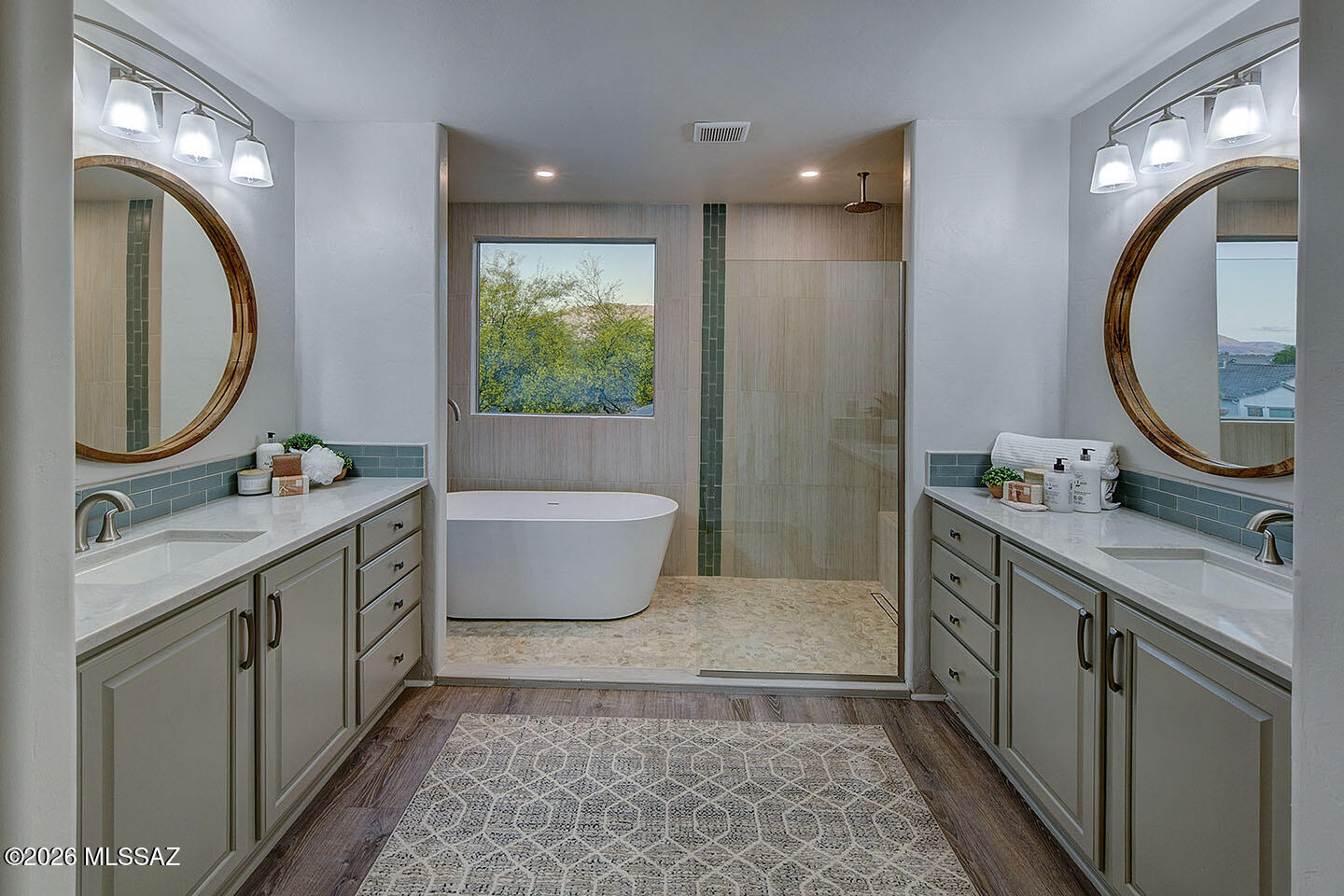 13464 North Piemonte Way Oro Valley, AZ 85755 - Photo 19 of 33 a bathroom with a double vanity sink mirror and bathtub