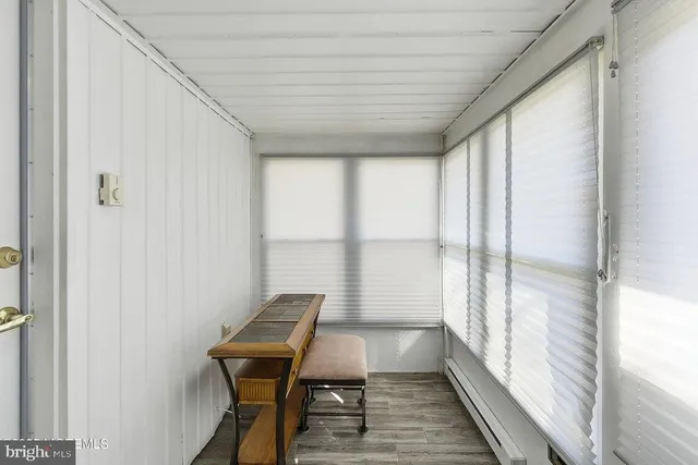 a view of a room with furniture and a window