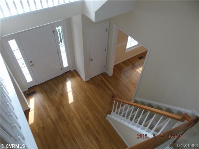 10320 Cattail Road Chesterfield, VA 23838 - Photo 11 of 24 a view of staircase with wooden floor and stairs