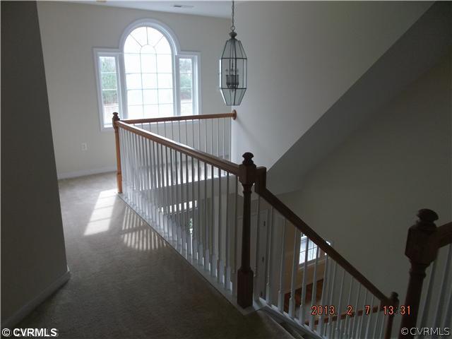 10320 Cattail Road Chesterfield, VA 23838 - Photo 15 of 24 a view of staircase with railing and white walls