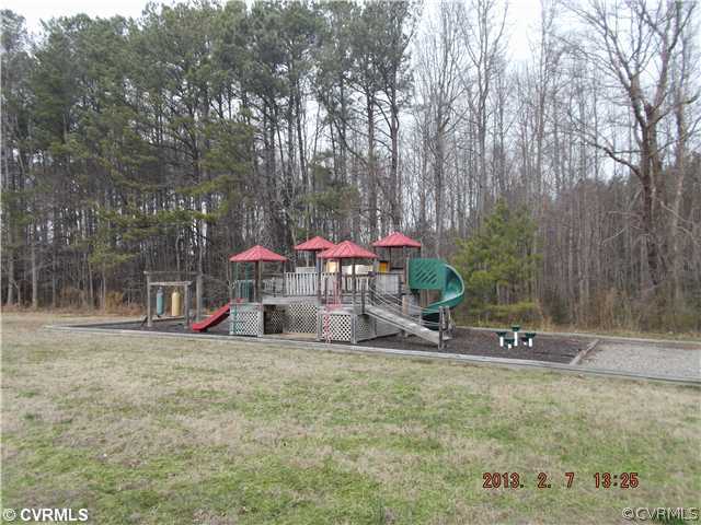 10320 Cattail Road Chesterfield, VA 23838 - Photo 24 of 24 a backyard of a house with table and chairs
