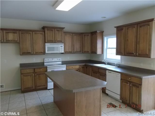 10320 Cattail Road Chesterfield, VA 23838 - Photo 5 of 24 a kitchen with a cabinets and white appliances