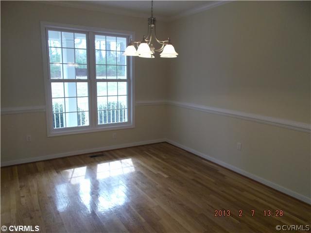 10320 Cattail Road Chesterfield, VA 23838 - Photo 6 of 24 a view of empty room with wooden floor and fan