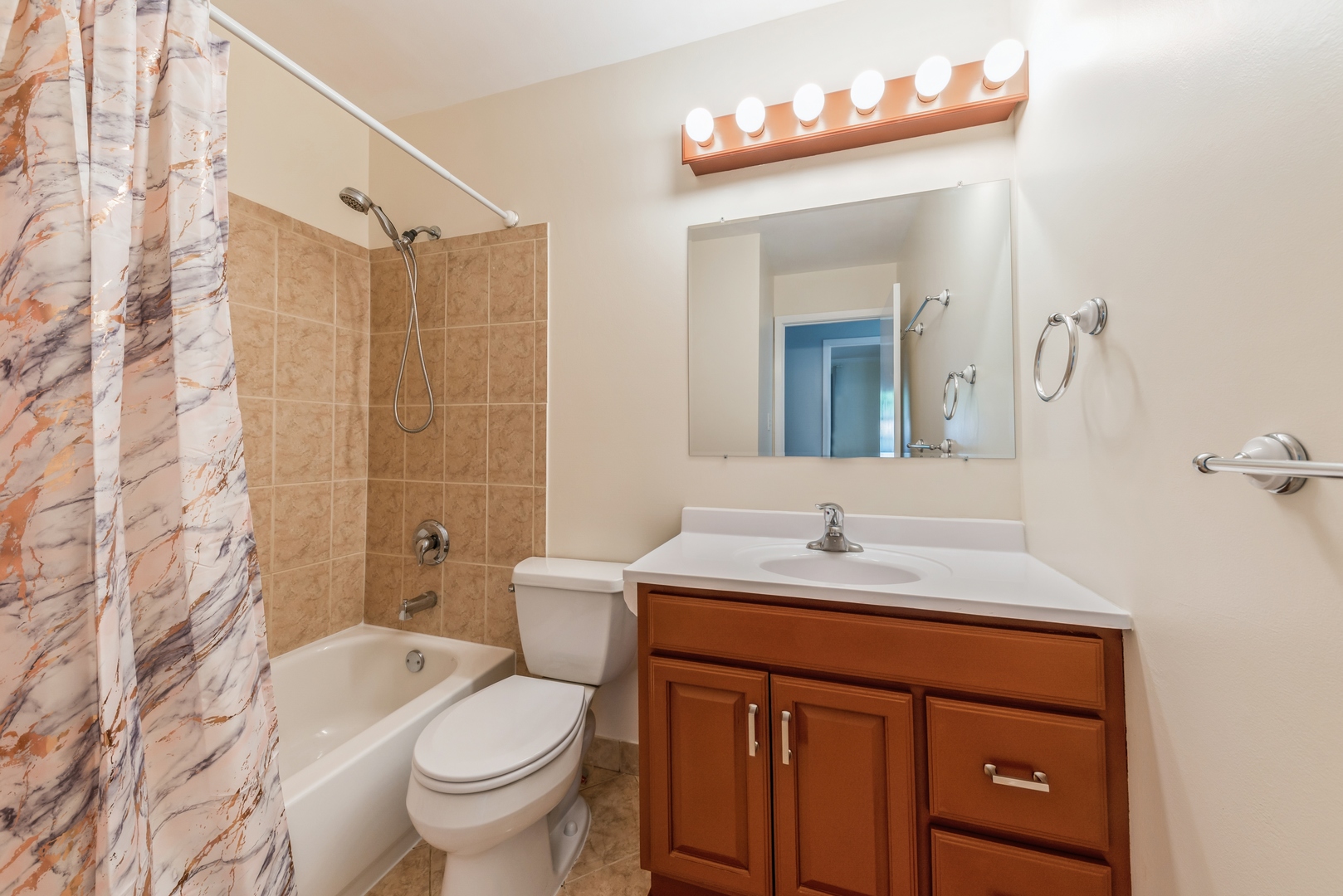 311 Weidner Road Buffalo Grove, IL 60089 - Photo 13 of 16 a bathroom with a sink vanity mirror and toilet