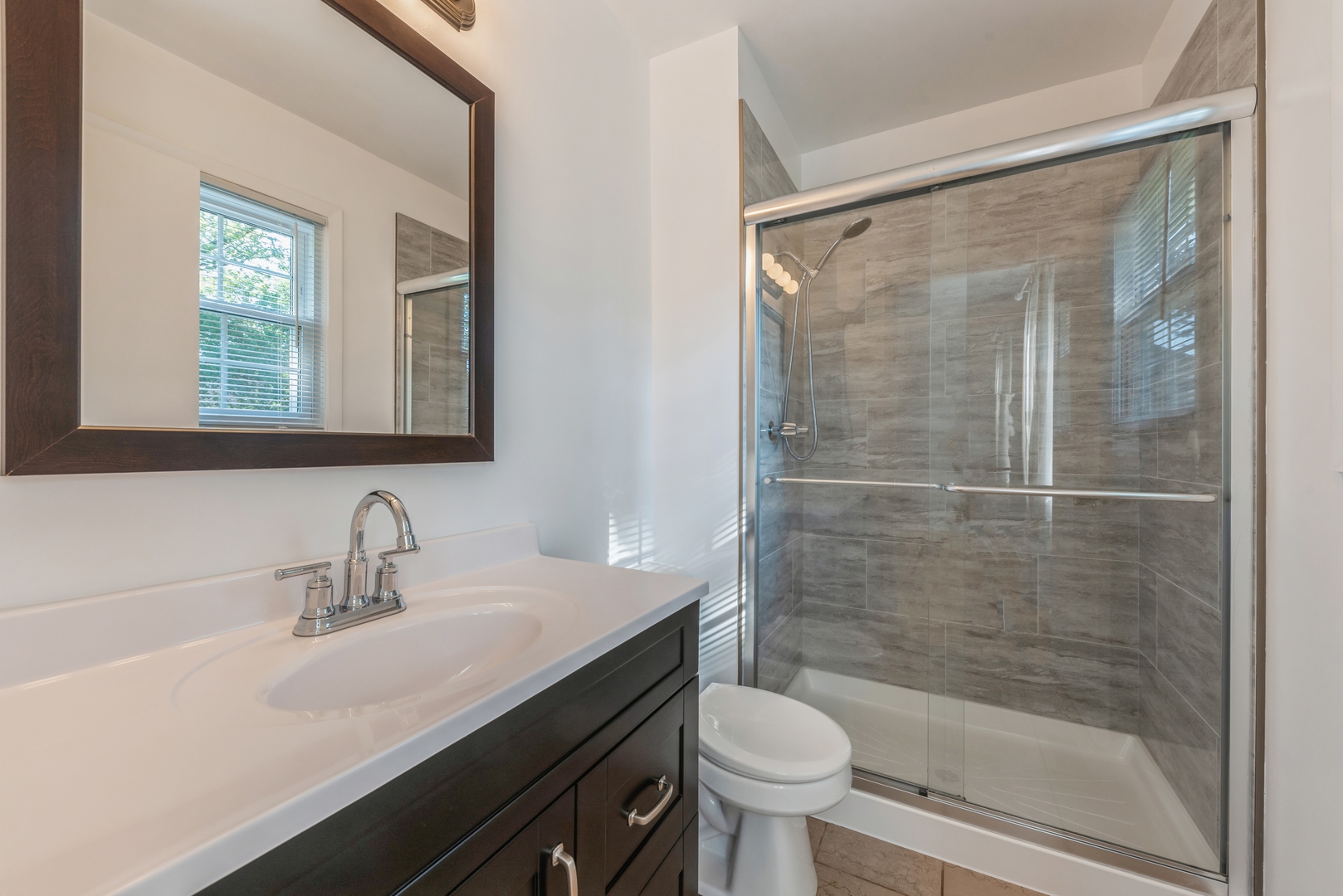311 Weidner Road Buffalo Grove, IL 60089 - Photo 10 of 16 a bathroom with a sink mirror toilet and bathtub