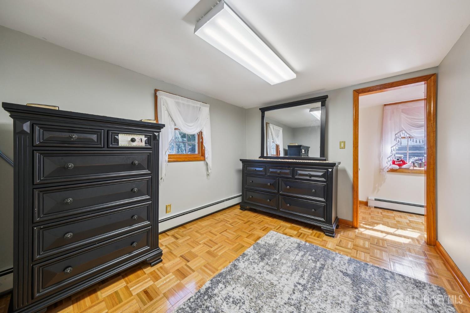 187 Hoover Avenue Edison, NJ 08837 - Photo 12 of 29 a view of room with flat screen tv and cabinet