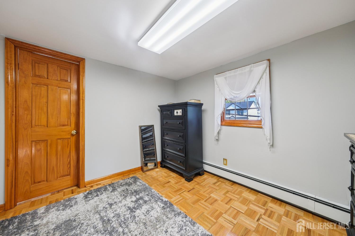 187 Hoover Avenue Edison, NJ 08837 - Photo 13 of 29 wooden floor and window in a room