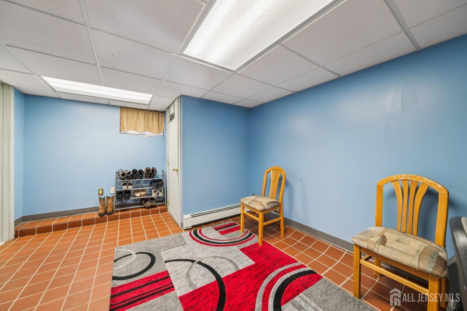 187 Hoover Avenue Edison, NJ 08837 - Photo 17 of 29 a room with gym equipment and wooden floor