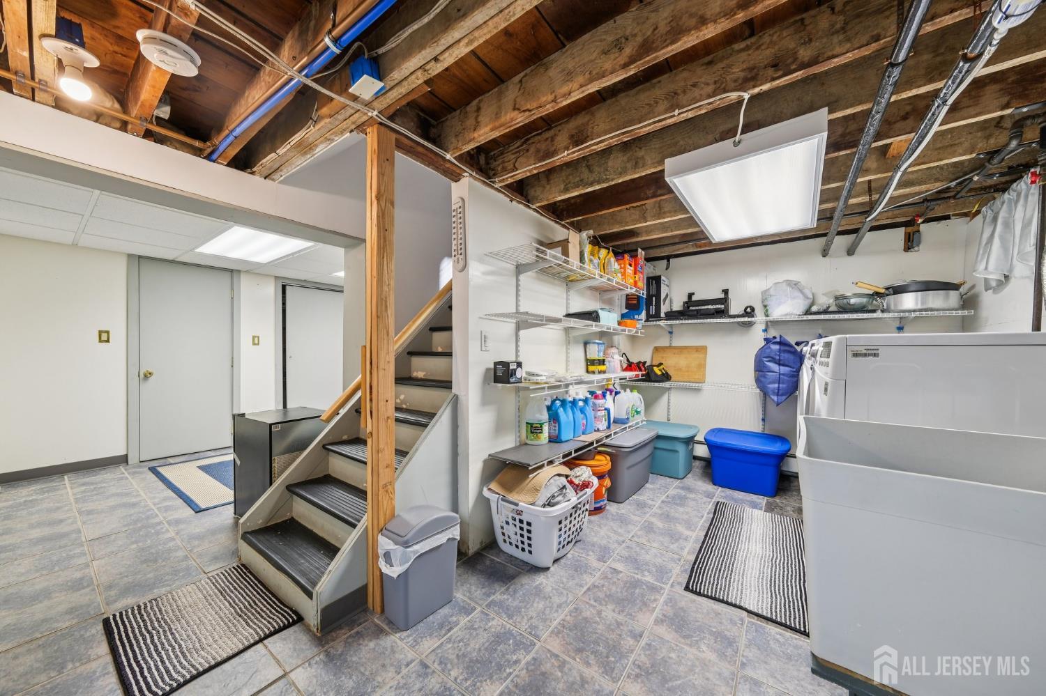 187 Hoover Avenue Edison, NJ 08837 - Photo 19 of 29 a view of storage and utility room with stairs