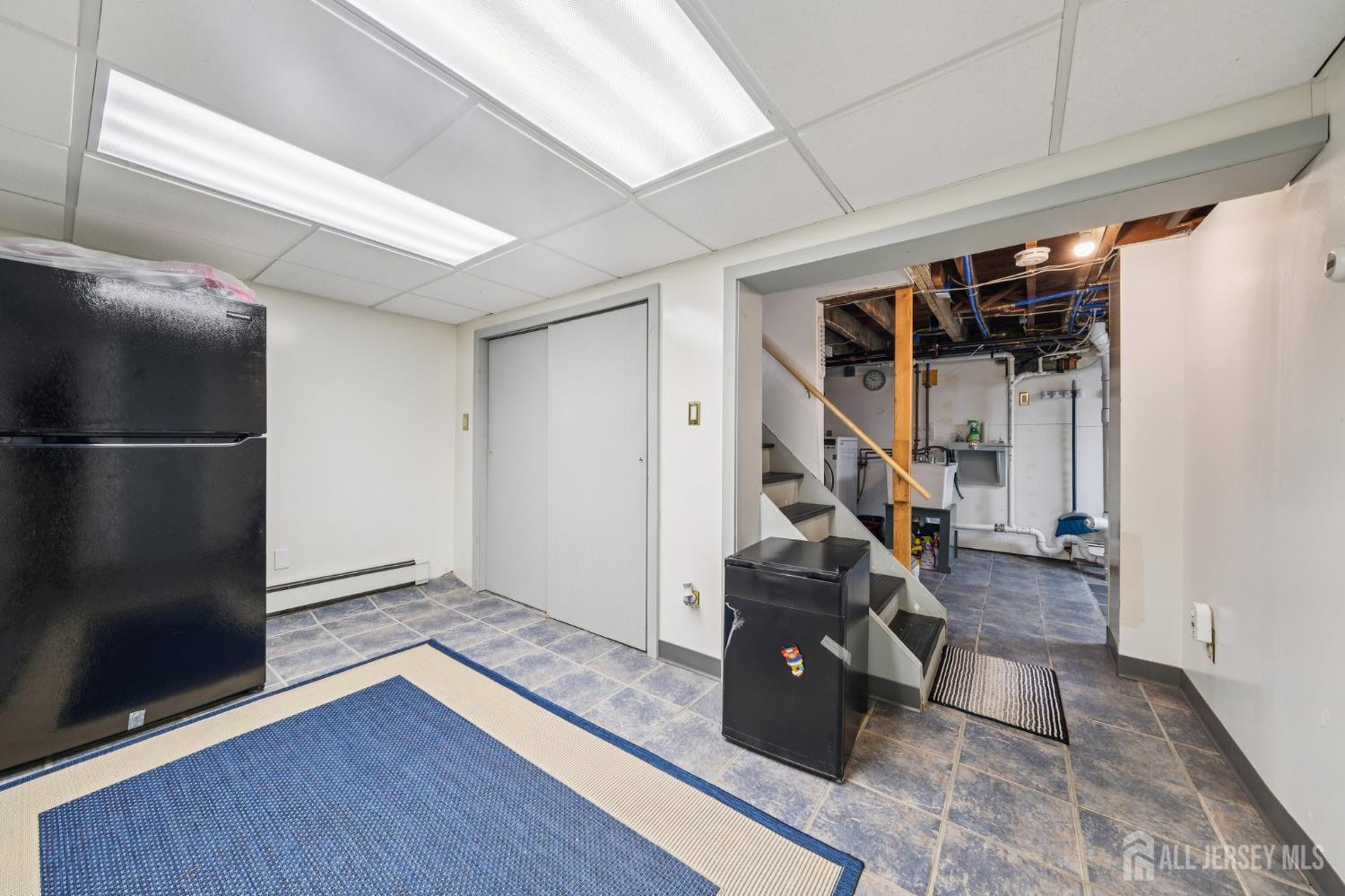 187 Hoover Avenue Edison, NJ 08837 - Photo 20 of 29 a view of a hallway with wooden floor and stairs