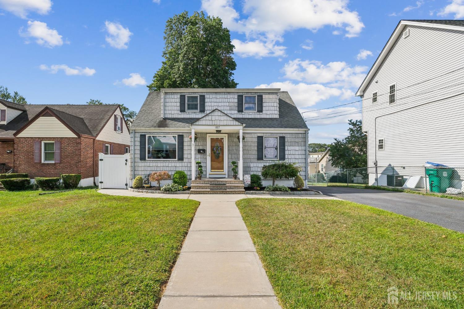 187 Hoover Avenue Edison, NJ 08837 - Photo 2 of 29 a front view of a house with a yard