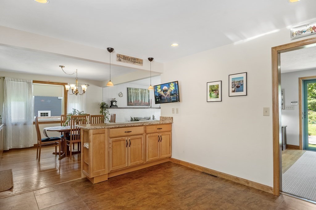 122 Chickering Road Dedham, MA 02026 - Photo 14 of 41 a large white kitchen with a large window