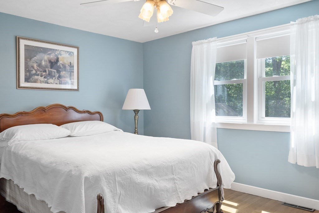 122 Chickering Road Dedham, MA 02026 - Photo 19 of 41 a large bed sitting in a bedroom next to a window