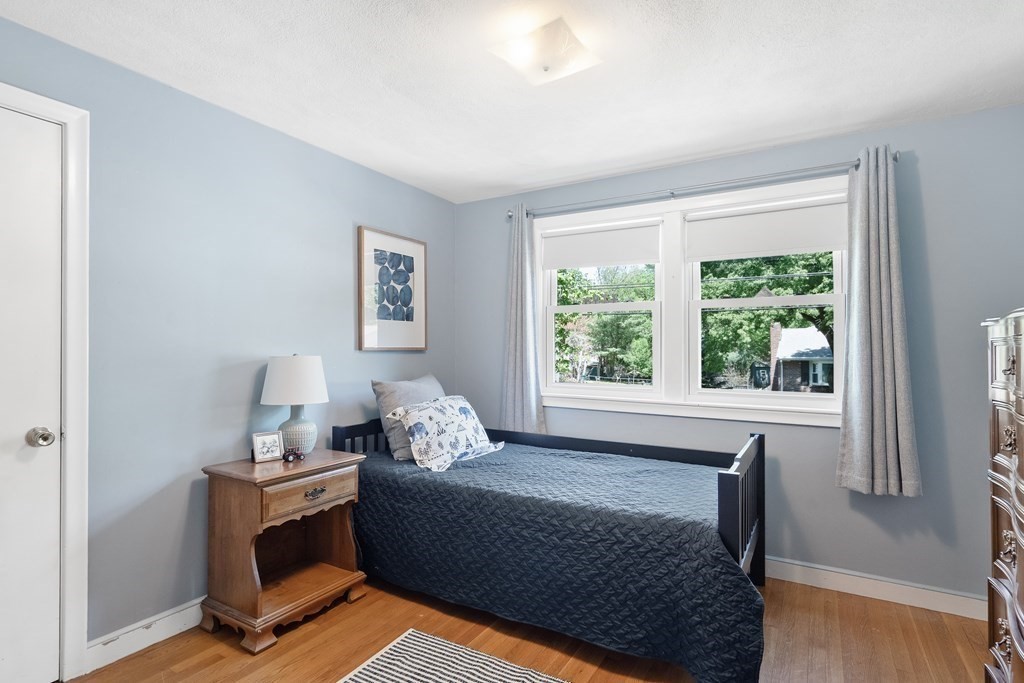 122 Chickering Road Dedham, MA 02026 - Photo 23 of 41 a living room with furniture and a window
