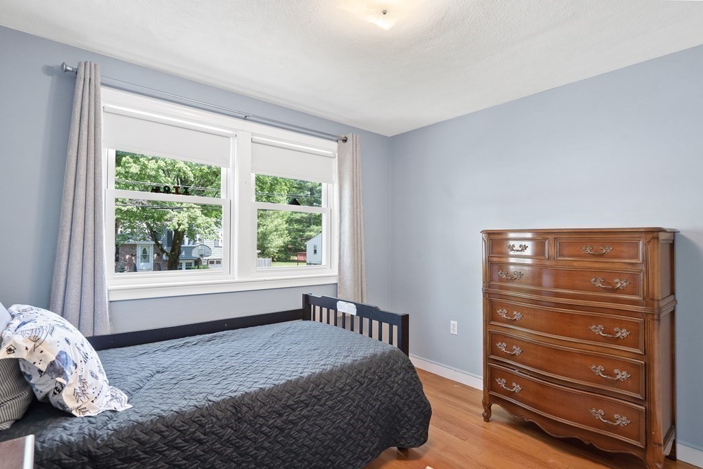 122 Chickering Road Dedham, MA 02026 - Photo 24 of 41 a bedroom with a bed and a window