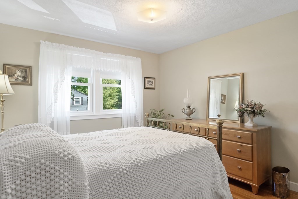 122 Chickering Road Dedham, MA 02026 - Photo 28 of 41 a bedroom with a bed and a dresser