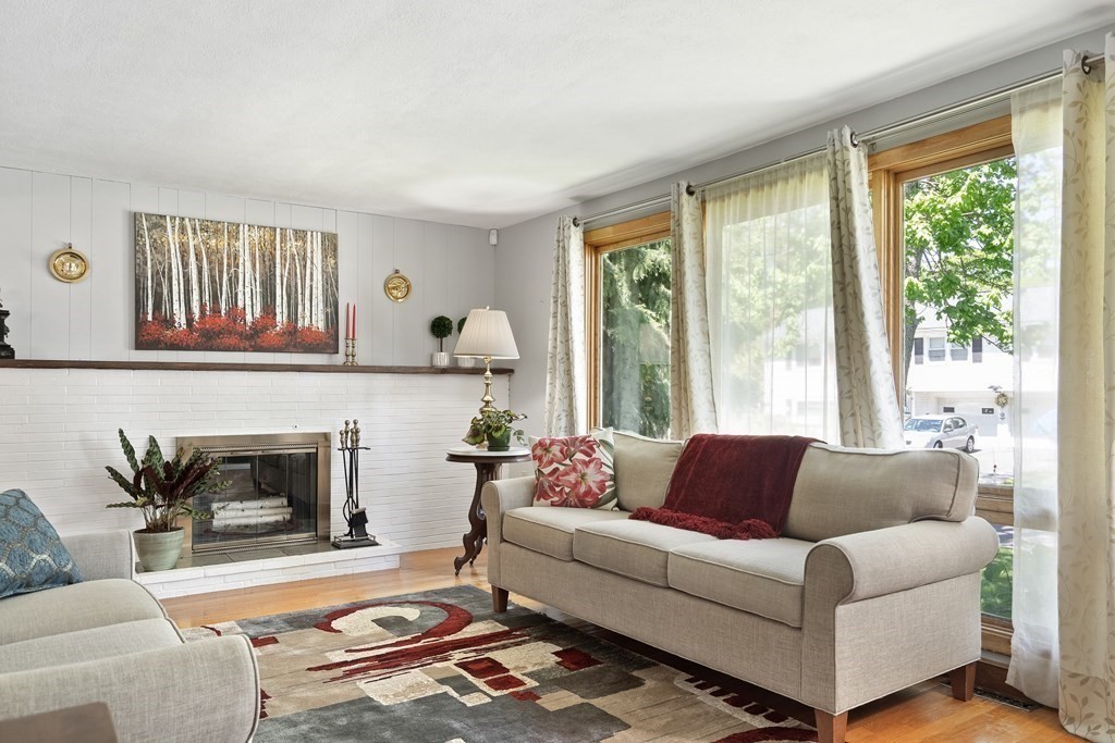 122 Chickering Road Dedham, MA 02026 - Photo 3 of 41 a living room with furniture and a fireplace