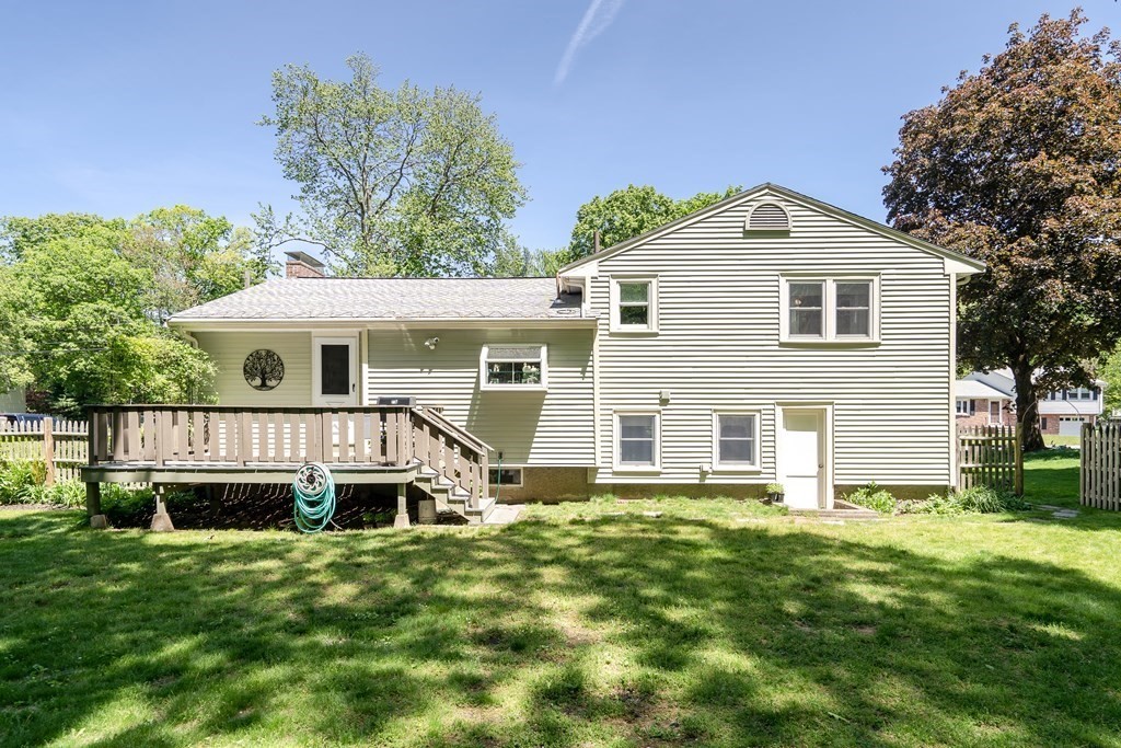 122 Chickering Road Dedham, MA 02026 - Photo 34 of 41 a front view of a house with a yard
