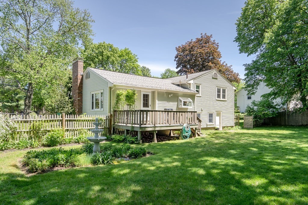 122 Chickering Road Dedham, MA 02026 - Photo 35 of 41 a view of a house with a yard and sitting area