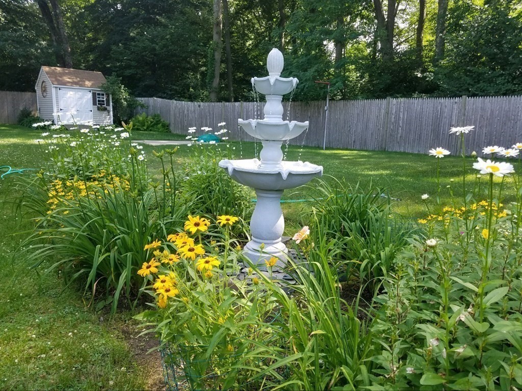 122 Chickering Road Dedham, MA 02026 - Photo 38 of 41 a view of a house with a sink and garden
